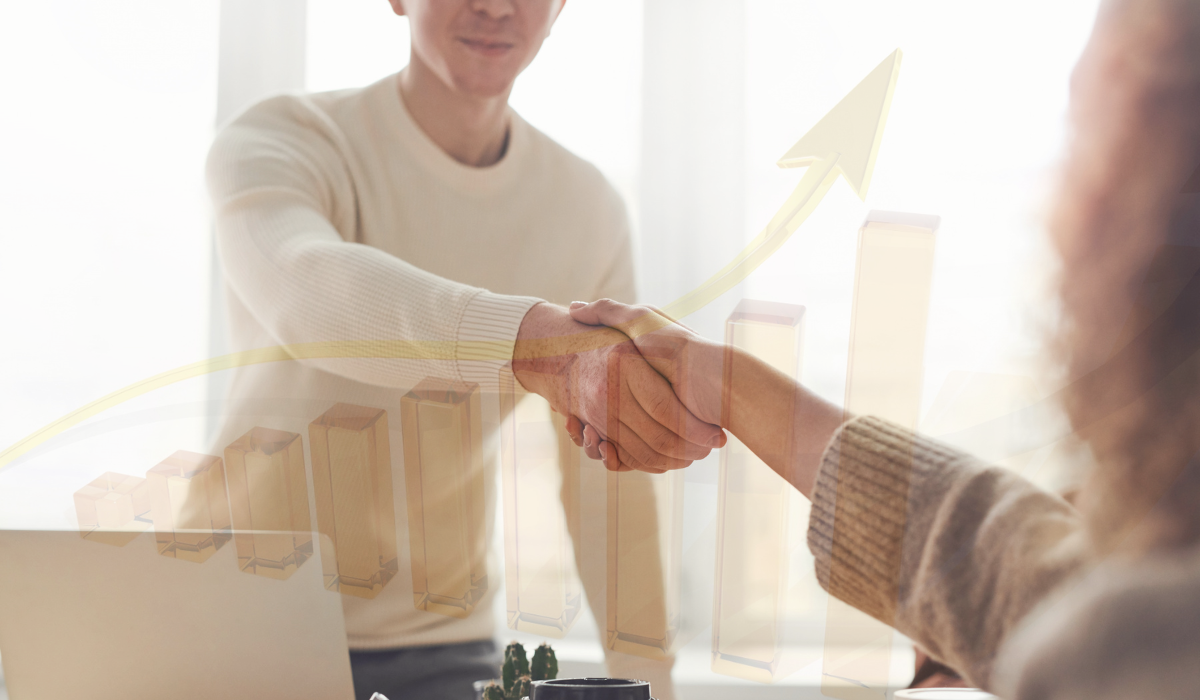 a photo of a handshake with a transparent overlay of a bar graph with an arrow